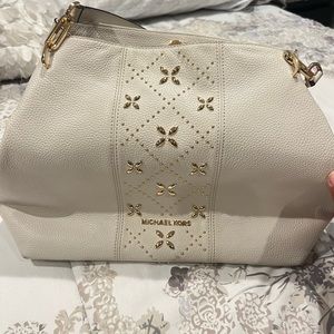 Michael Kors lettering logo on bottom front
Interior.